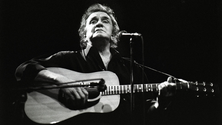Johnny Cash performing on stage