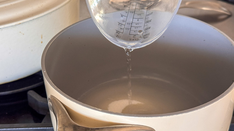 adding water to pot