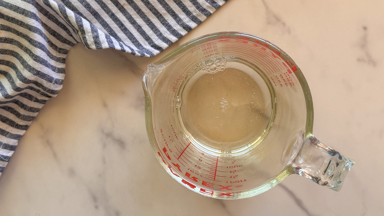 simple syrup in glass cup