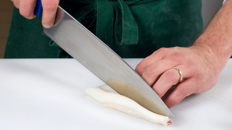 Chef using the pinch grip on a knife