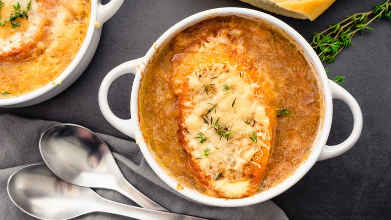bowl of French onion soup and spoons