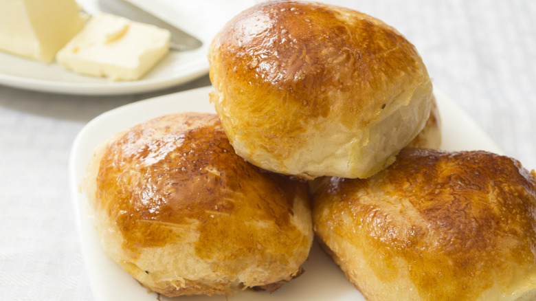 Golden dinner bread rolls on a plate