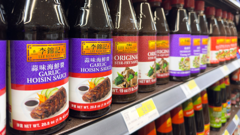 a display of hoisin and other Asian sauces at store