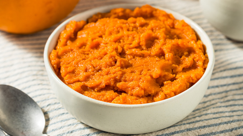 A bowl of pumpkin puree sitting in a white ramekin