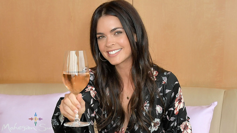 Katie Lee Biegel holding glass of wine