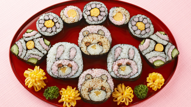 Sushi with designs on red platter