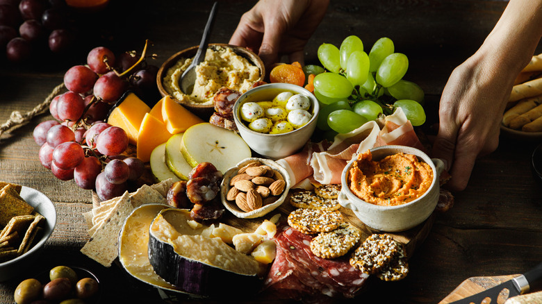 board with variety of snack foods