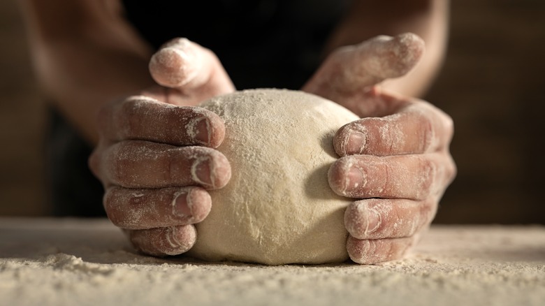 hands shaping bread