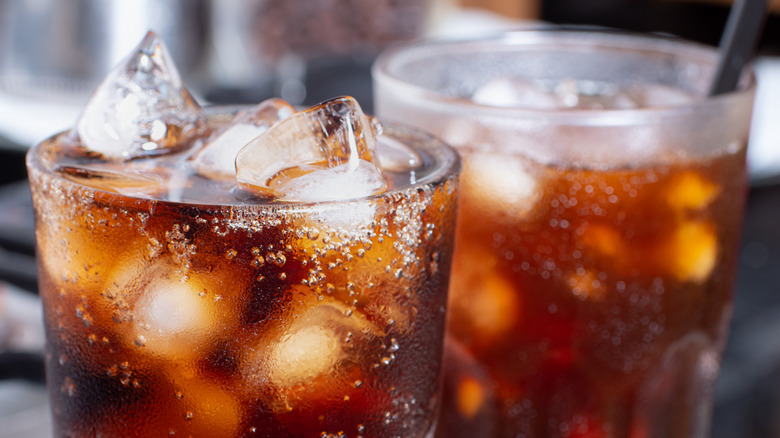 top of a glass of soda with effervescent bubbles