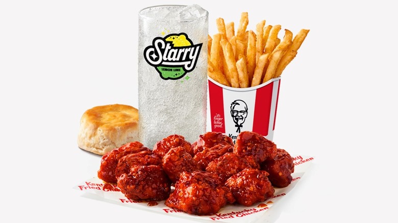 A KFC Saucy Nuggets Combo with Starry, fries, and a biscuit