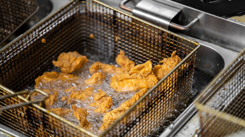 Chicken pieces fryer boiling oil