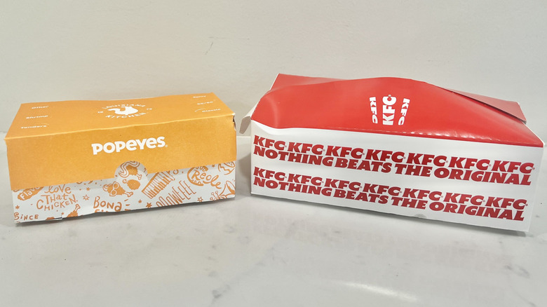 To-go boxes from KFC and Popeyes.