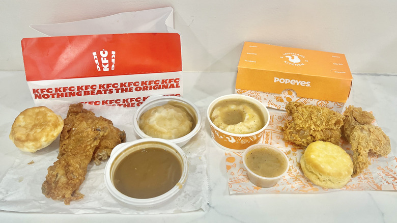 Chicken, mashed potatoes, and gravy meals from KFC and Popeyes.