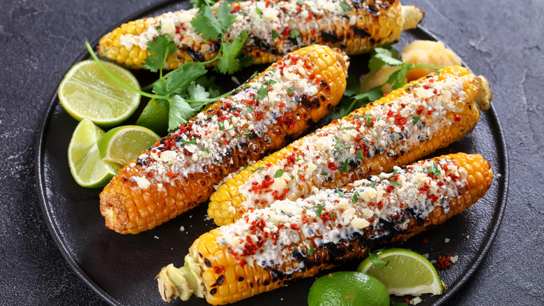 A plate of grilled corn on the cobs