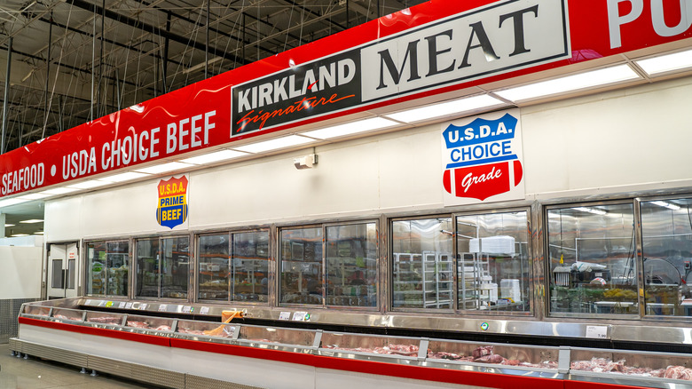 a Kirkland Signature Meat sign from inside a Costco