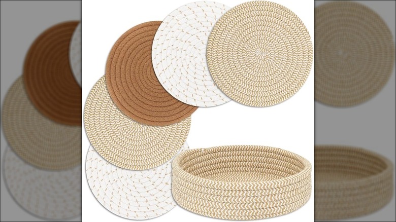 Four brown, white, tan trivets above storage basket