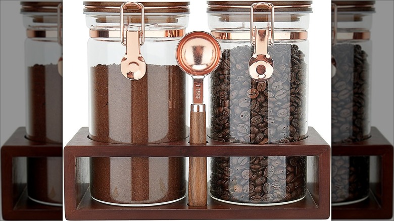 Two Siqolny Glass Coffee Containers on wooden shelf with scoop