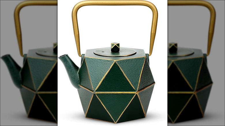 Green and gold cast iron teapot