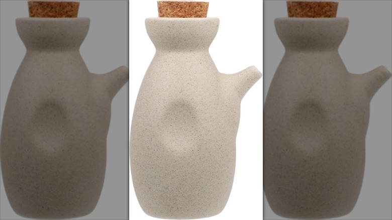 Beige ceramic soy sauce dispenser with cork lid