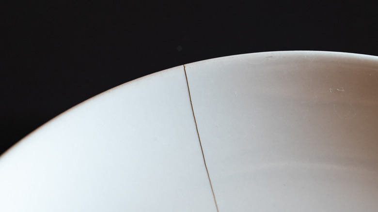 Cracked plate on dark background