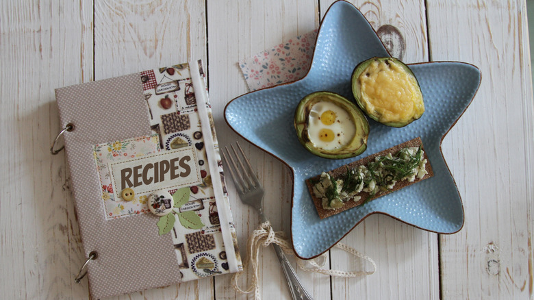 Scrabook cookbook with plate of food