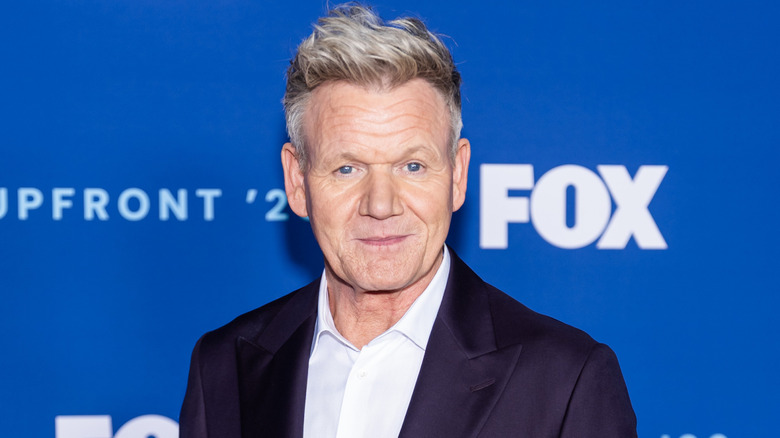 Chef Gordon Ramsay in suit with white shirt