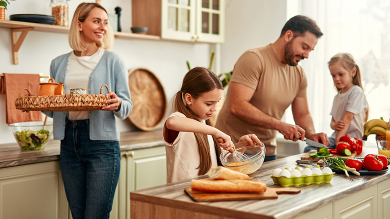 Happy family cooking together in the kitchen