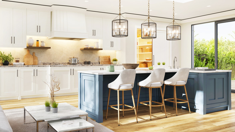 A modern, open kitchen with beautiful lighting