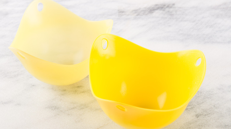 Two silicone egg poachers