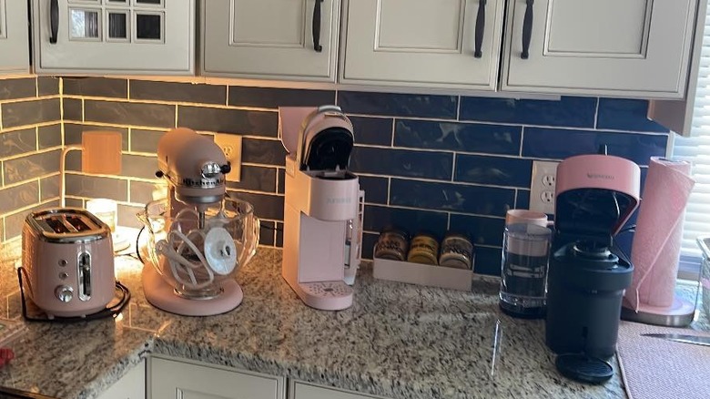 Various pink kitchen appliances on a countertop
