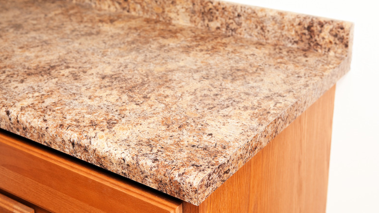 A laminate kitchen countertop in a stone style