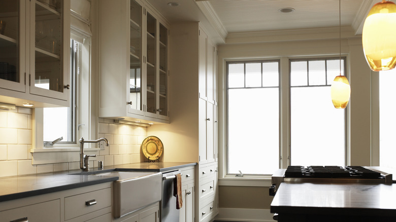 updated kitchen with pendant lighting over the island