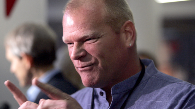 HGTV host Mike Holmes, in a blue collarless shirt