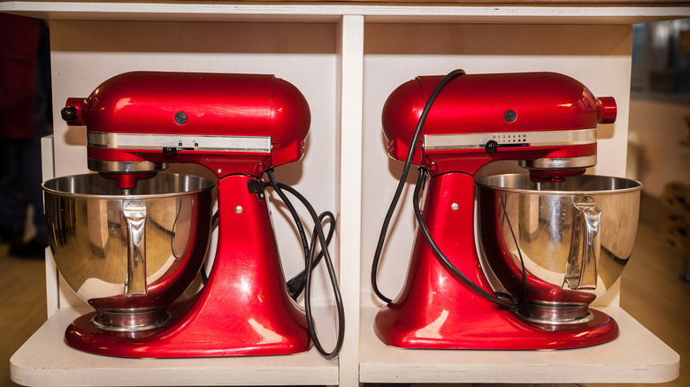 two stand mixers in storage