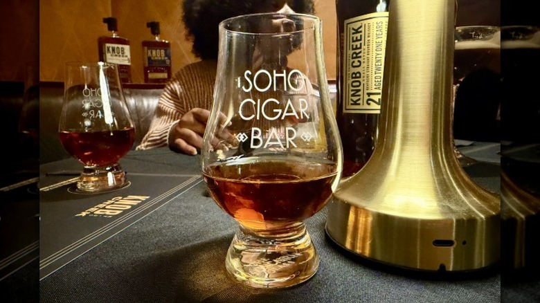Sample of Knob Creek 21 Year bourbon in a tasting glass at the SoHo Cigar Bar in NYC