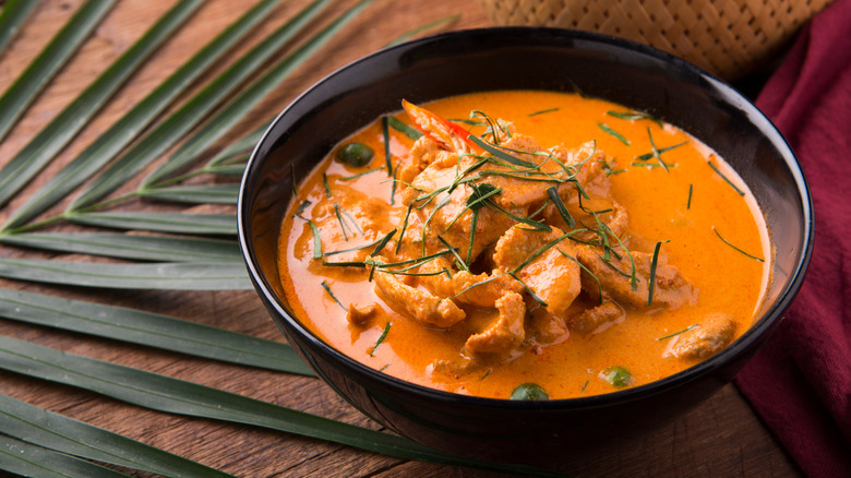 Bowl of red Thai curry chicken soup