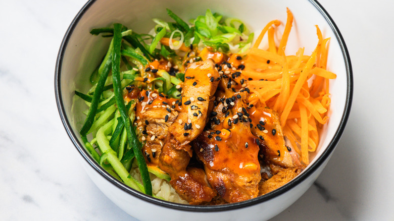 Close up on Korean BBQ chicken rice bowl.