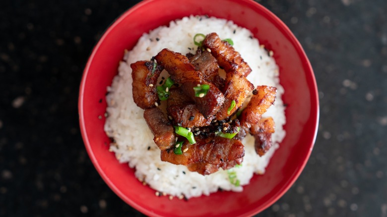 Chopped Korean flavored bacon on rice