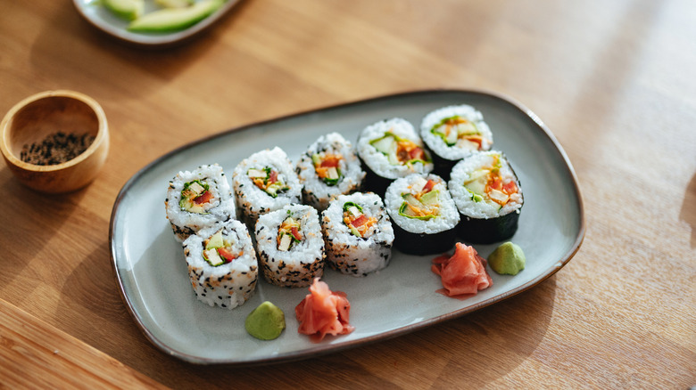Plate of sushi served with ginger and wasabi