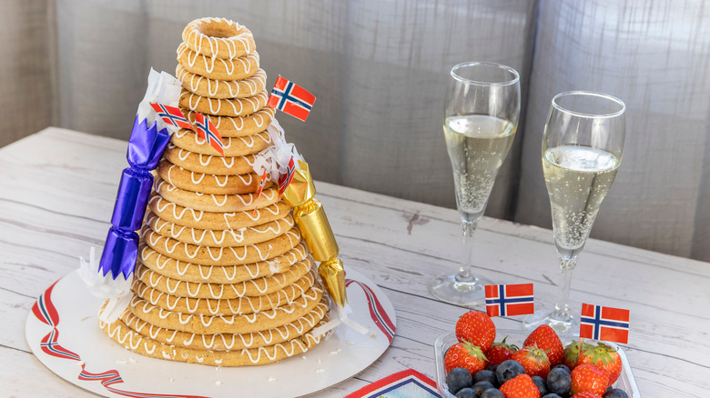 decorated Kransekake with glasses of champagne
