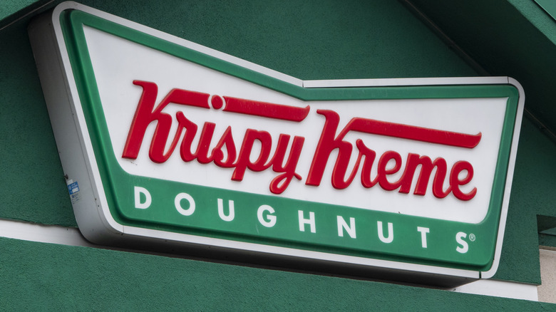 Close up of Krispy Kreme sign on storefront