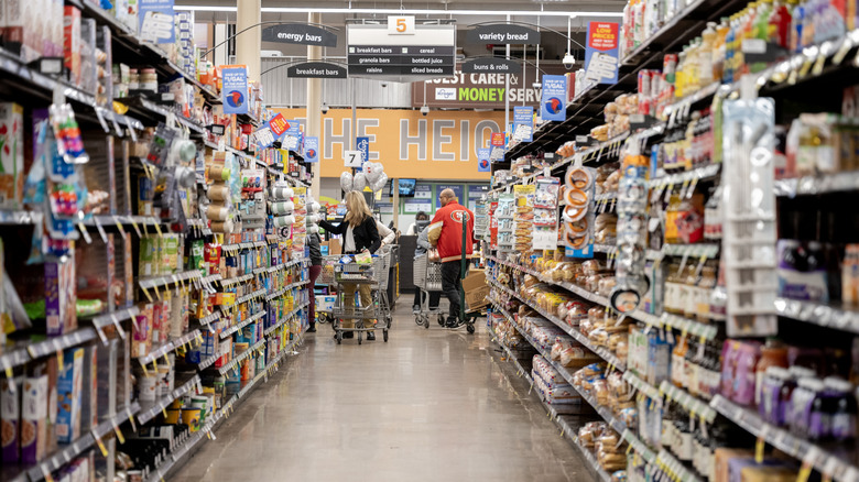 Customers in a shopping aisle at Kroger