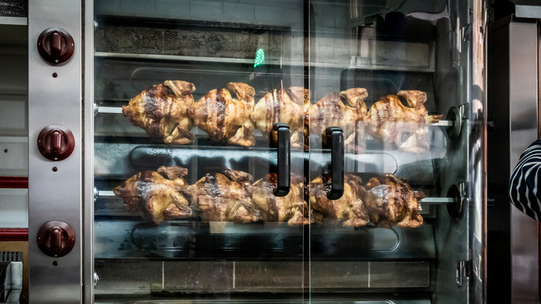 An oven of rotisserie chickens