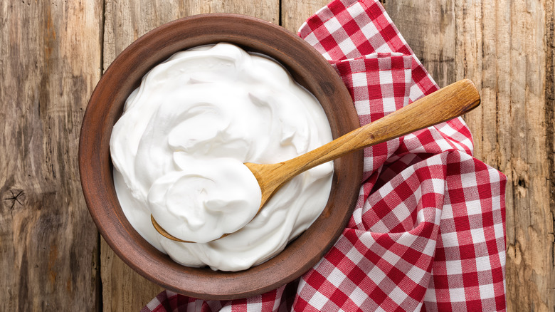 Greek yogurt in a bowl with a spoon