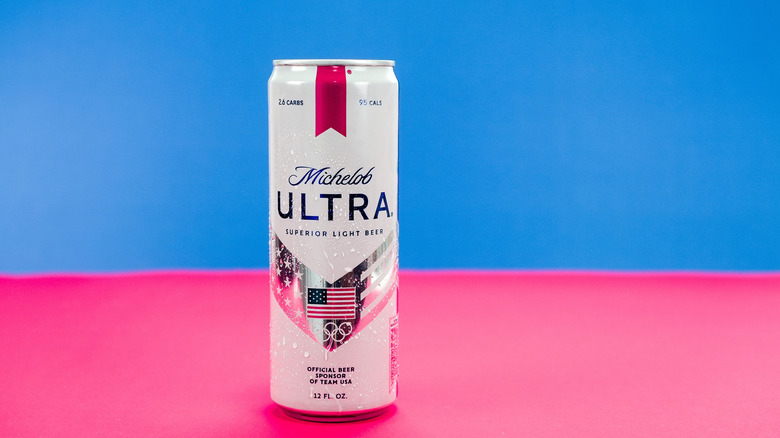 A can of Michelob Ultra posed in front of a colorful background