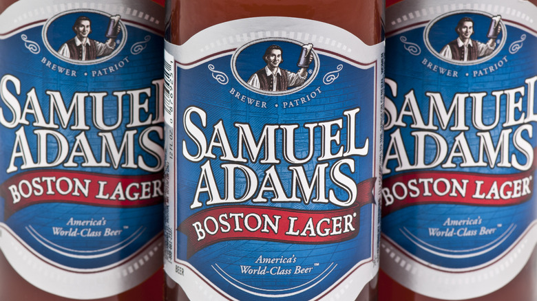 A close up on the labels of three bottles of Samuel Adams Boston Lager