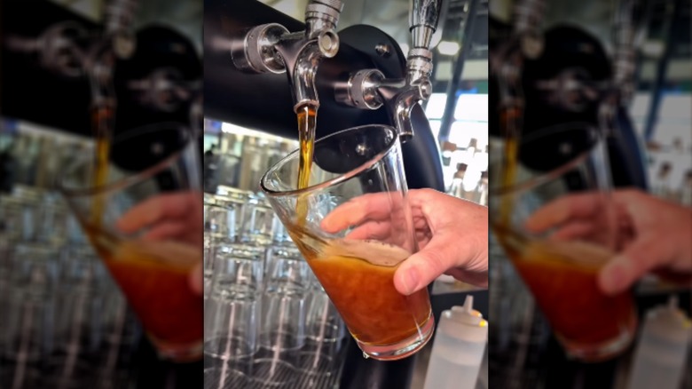 Drink being poured at Evolve Brewing