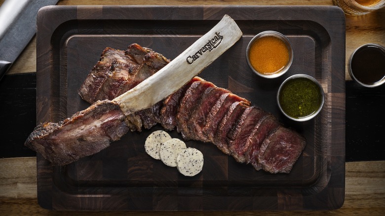 Carversteak tomahawk steak with branded bone on top