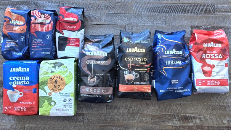 Bags of coffee on brown wooden surface