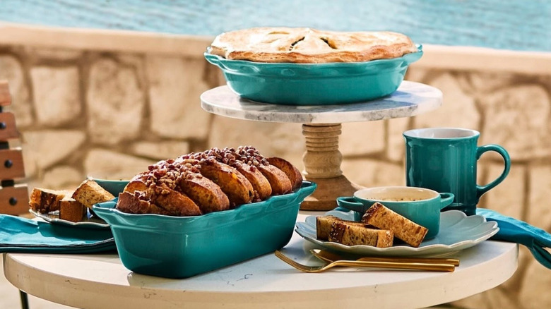 Le Creuset products with pies and breads